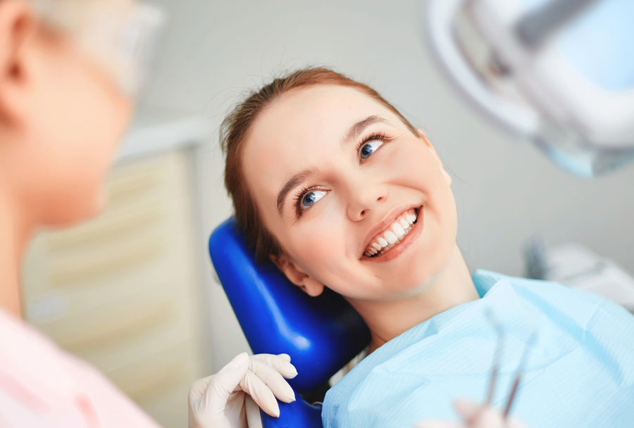 Teen girl seated at orthodontic consultation